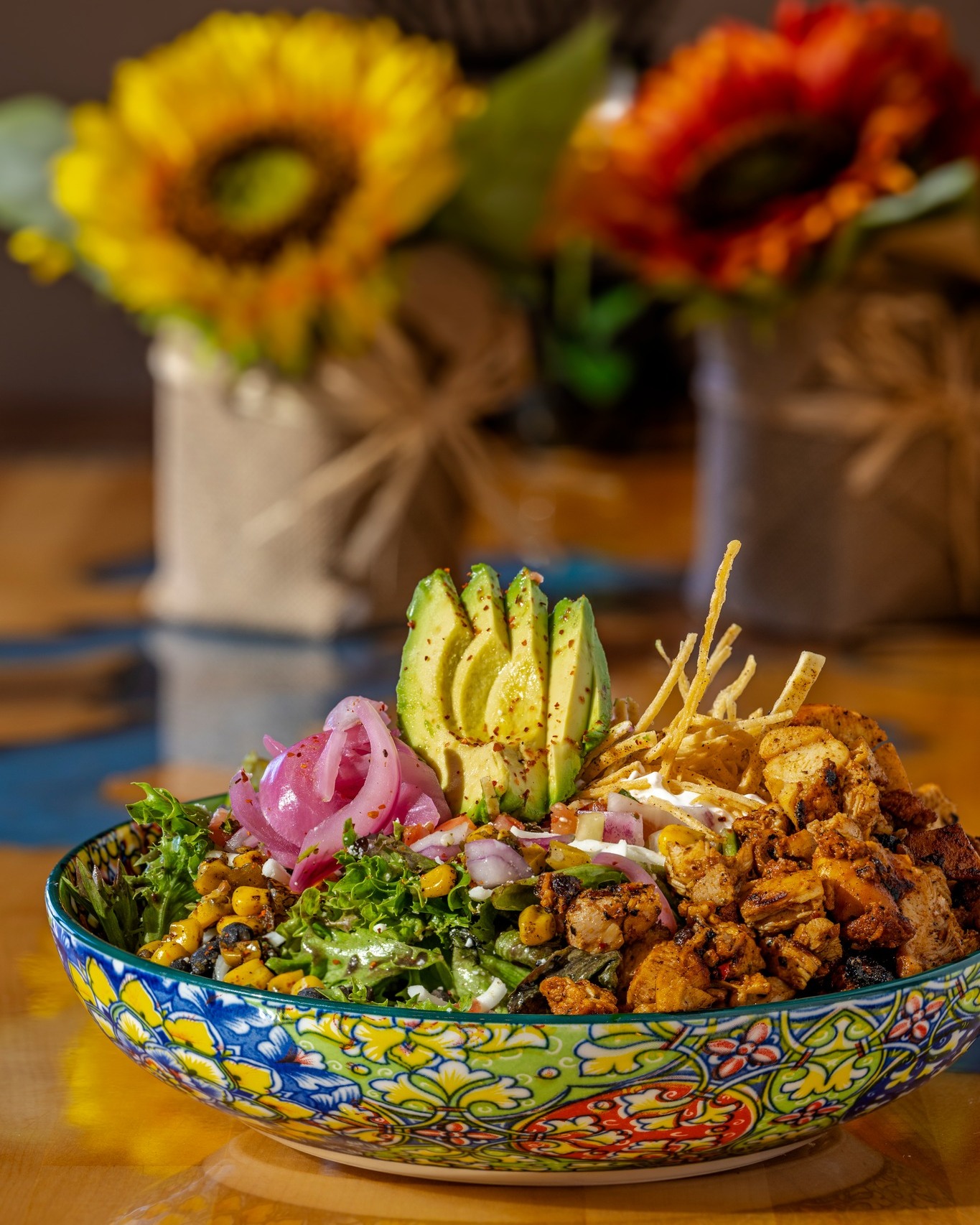 Taco Salad with Chicken
.
Veggies & Toppings
Pico de gallo
Pickled red onions
Black beans, drained & rinsed
½ avocado per salad (fanned for presentation)
Tortilla strips
Cotija cheese, crumble
Shredded mozzarella
.
Restaurant:  El Jefe's Gril
Photography by: @joelrinerphotography