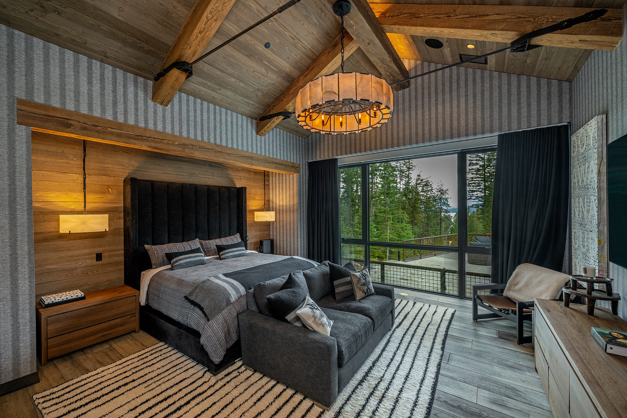 The primary bedroom features custom reclaimed timber and steel designed by Eric Hedlund Design