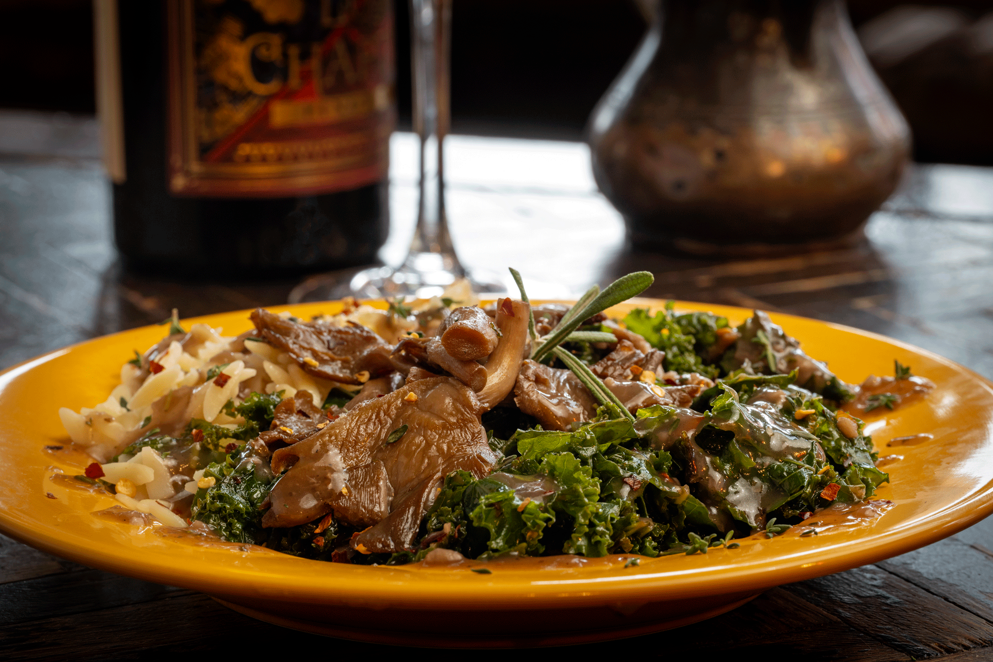 Braised Kale with oyster mushrooms over orzo.