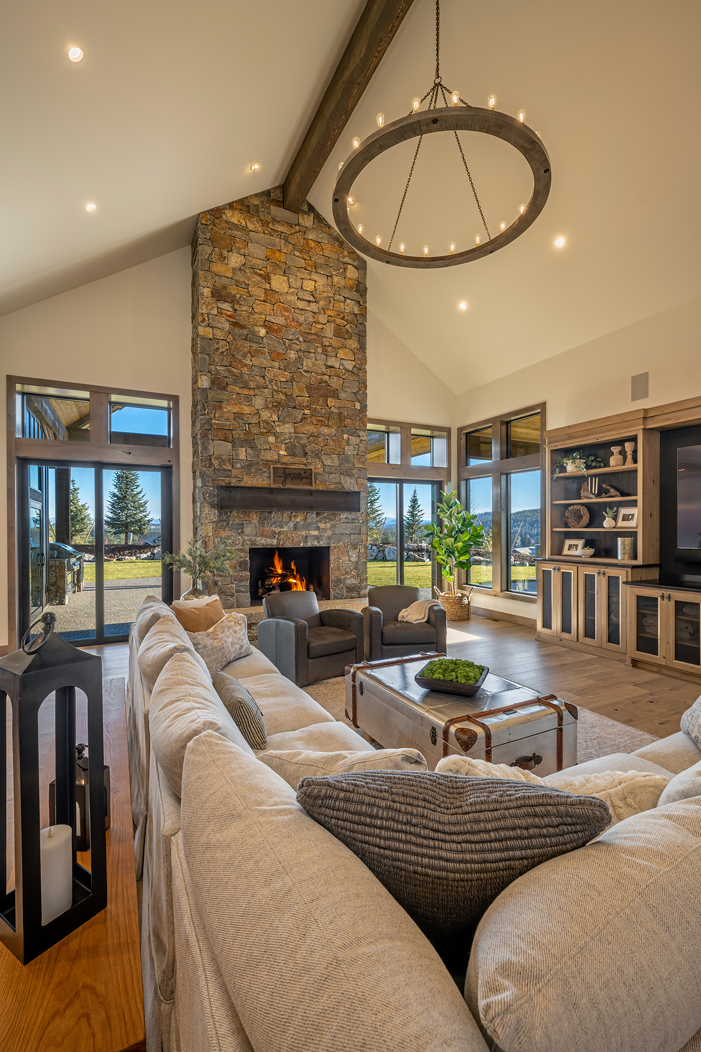 The stone fireplace is the centerpiece of the great room.